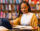 Young woman reading in a library