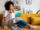Young woman relaxing on a yellow couch