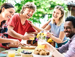 group of young adults enjoying lunch